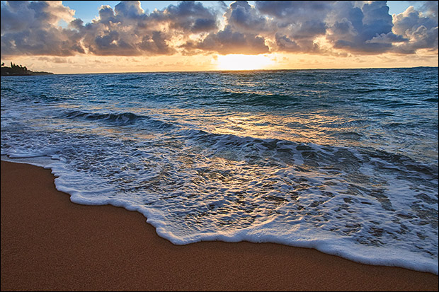 Waves and sunrise on the island of Kauai, HI